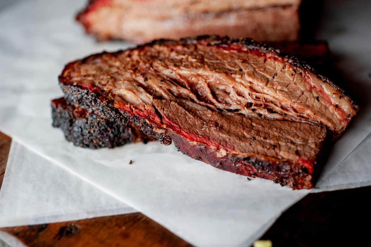 A slice of moist looking brisket with a fantastic smoke r.