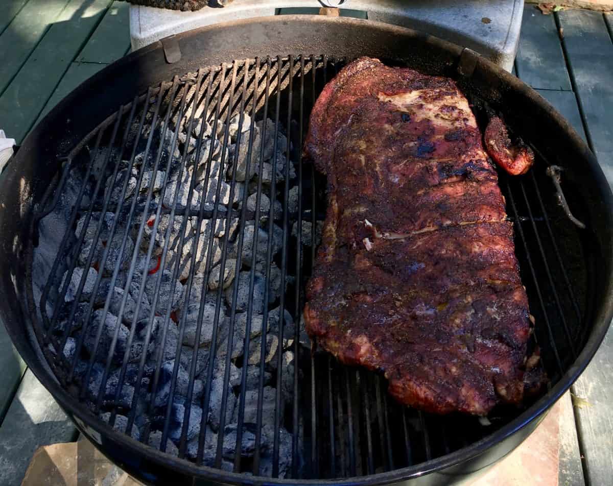 indirect grilling ribs on a charcoal kettle style gr.