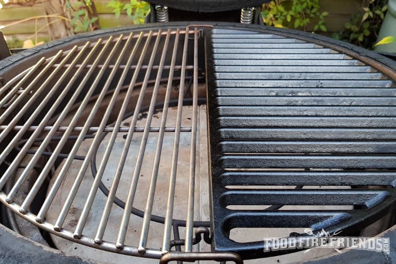 Close up of a half cast iron and half stainless steel grate installed into a Kamado Joe