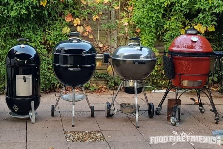Wide shot of different types of smokers and grills