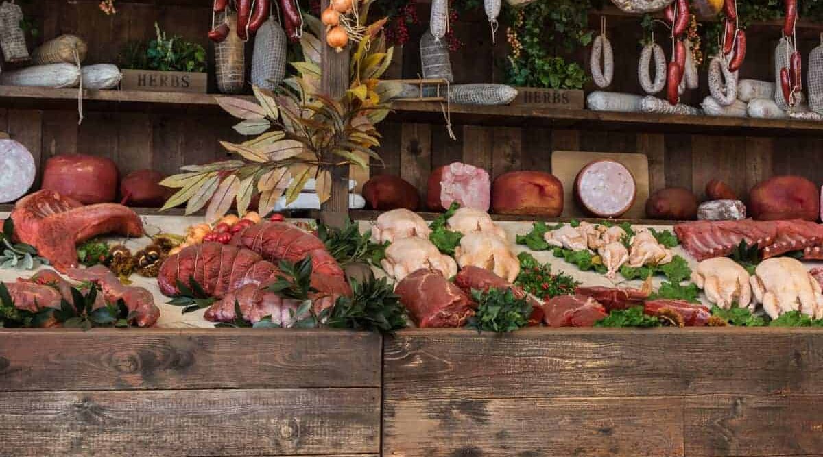 A selection of large joints of meat and sausages.