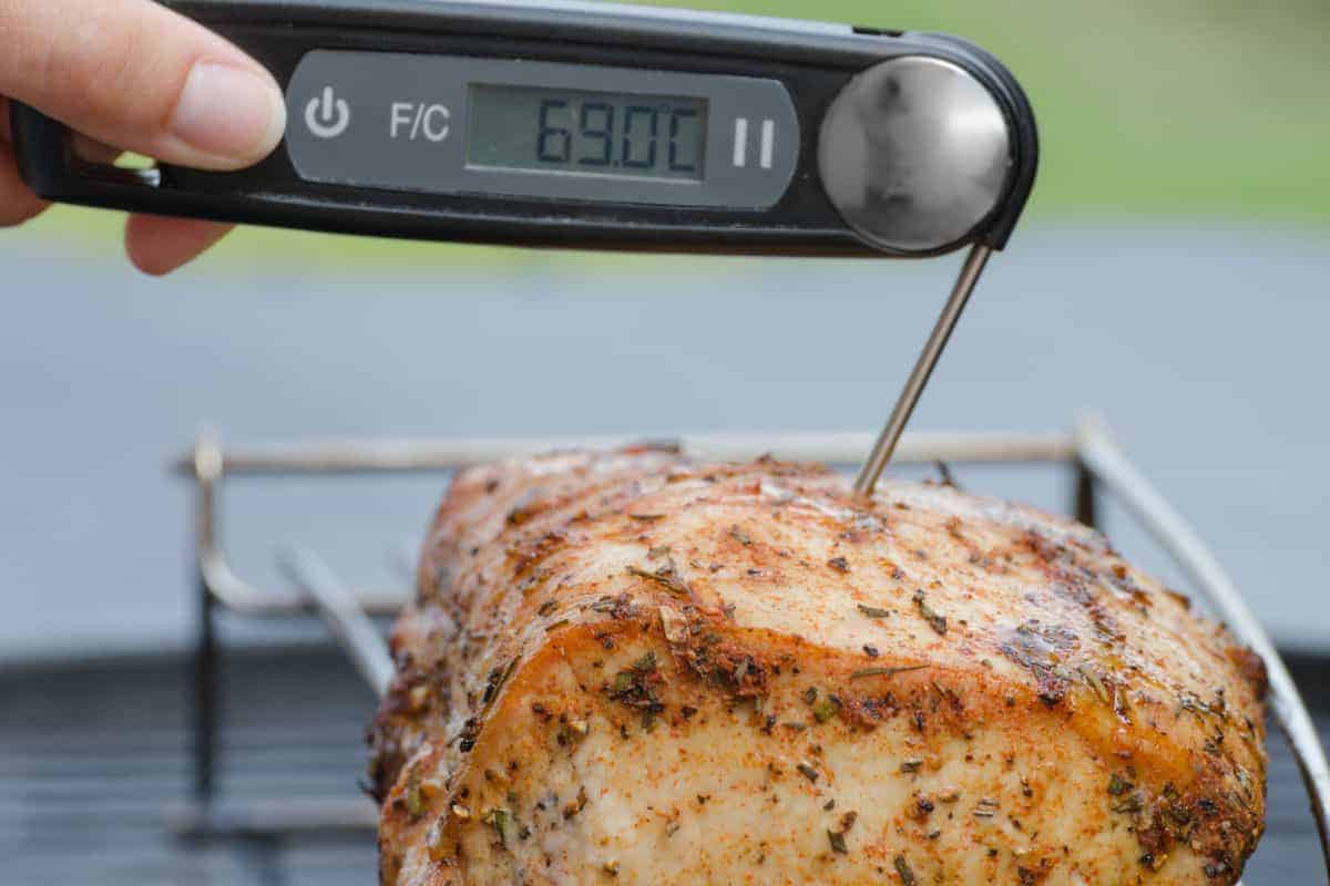 Taking the temperature of rested pork