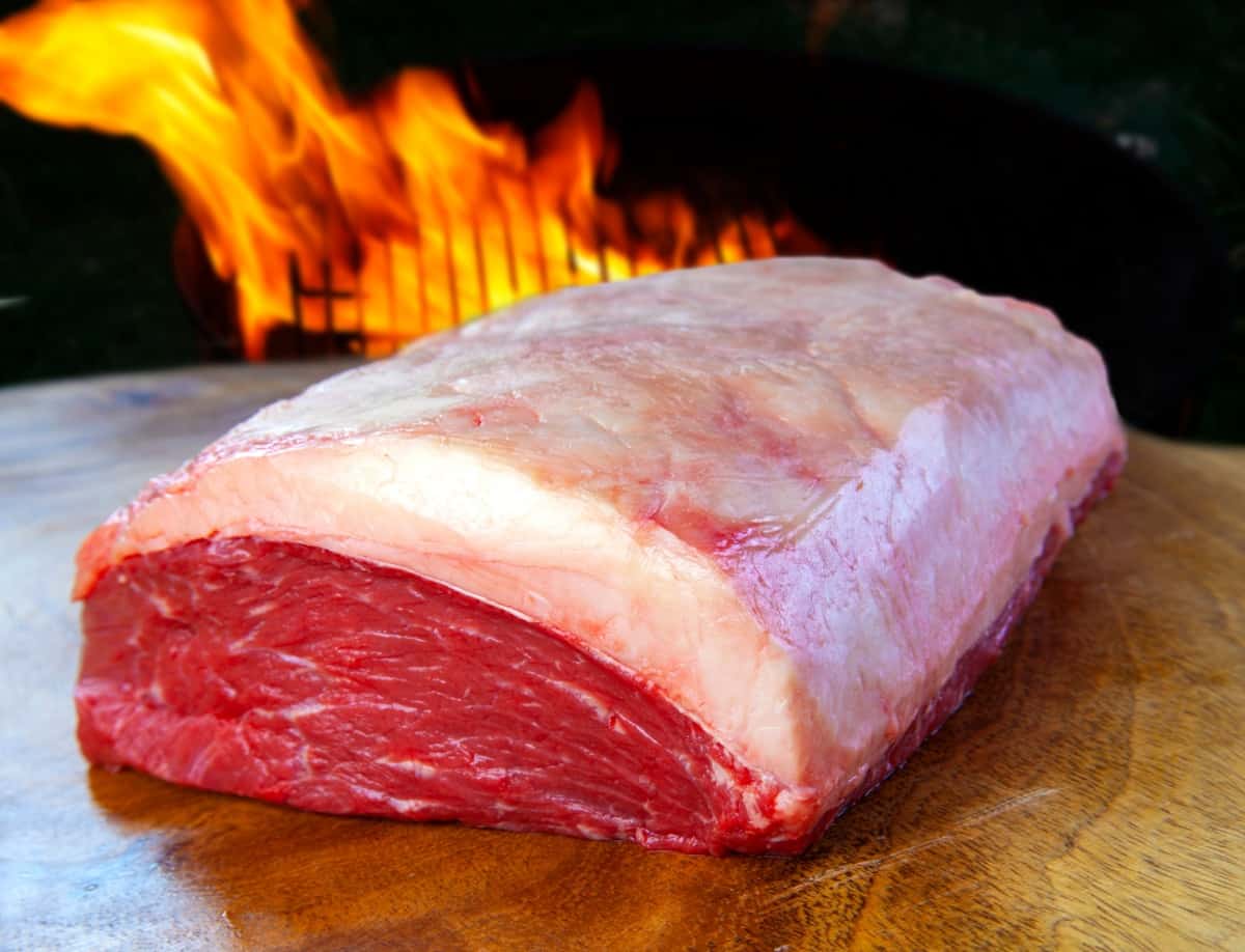 A picanha roasting joint with a very large fat .