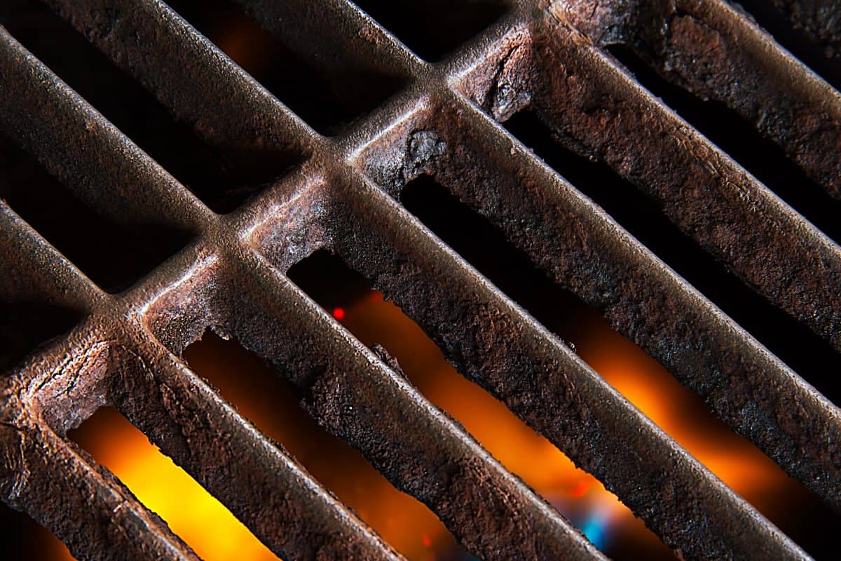 Close up of rusty cast iron grill gra.