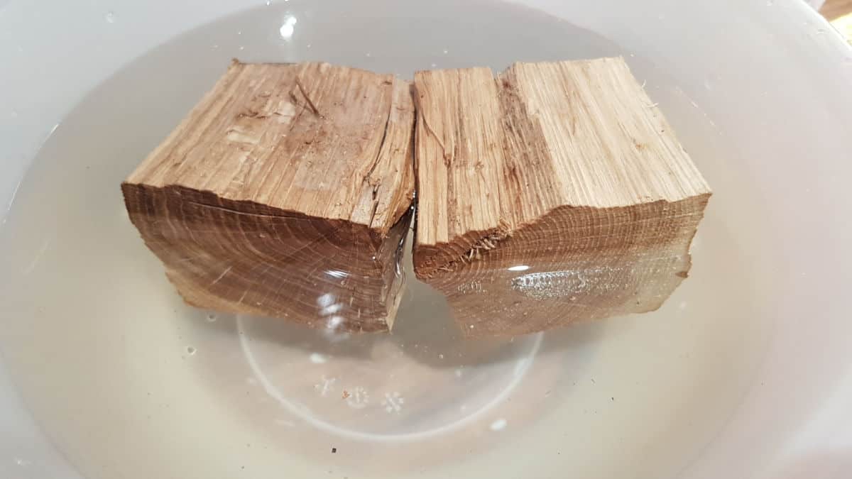 2 chunks of oak wood soaking in a b.