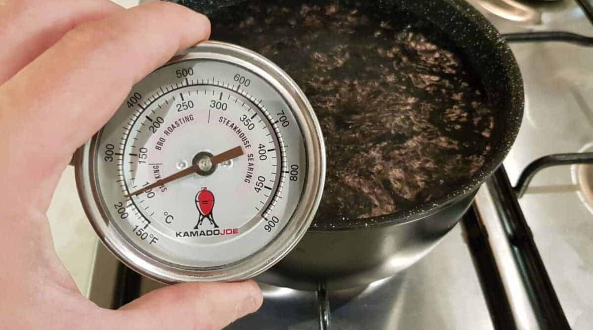 Kamado Joe dome thermometer being calibrated in boiling water.