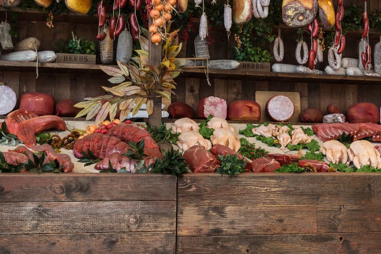 A selection of large joints of meat and sausages