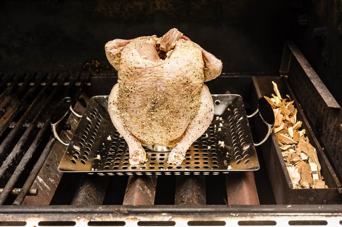 beer can chicken on grill, with wood chips