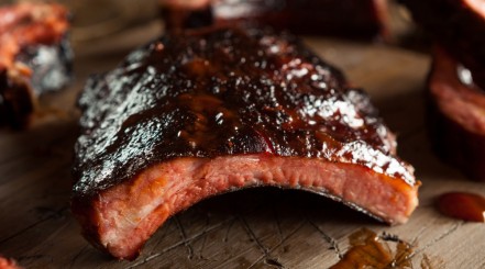 Close up of delicious looking, sticky sauce coated pork ribs