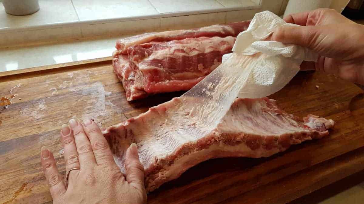 Removing the membrane from some pork ribs