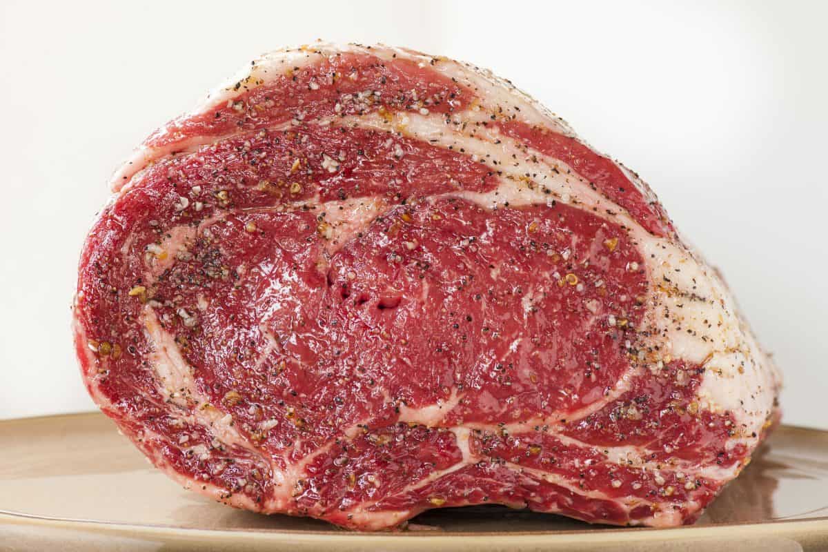 Side view of prime rib prepared for cooking