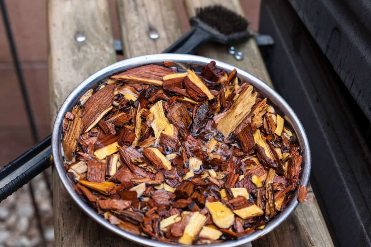 Mesquite wood chips being soaked in water before use for smoking