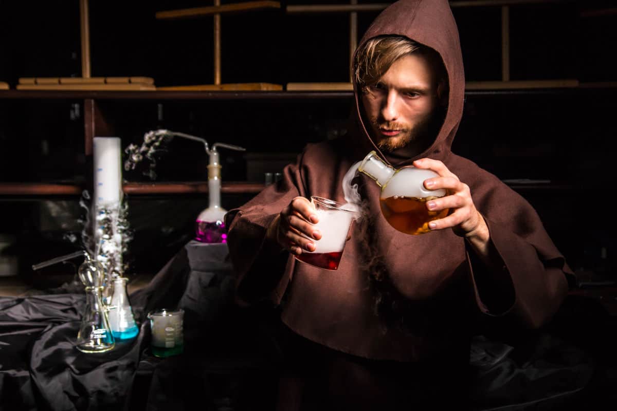 Mocked up image of fake liquid smoke being poured from a flask to a beaker by a chem.