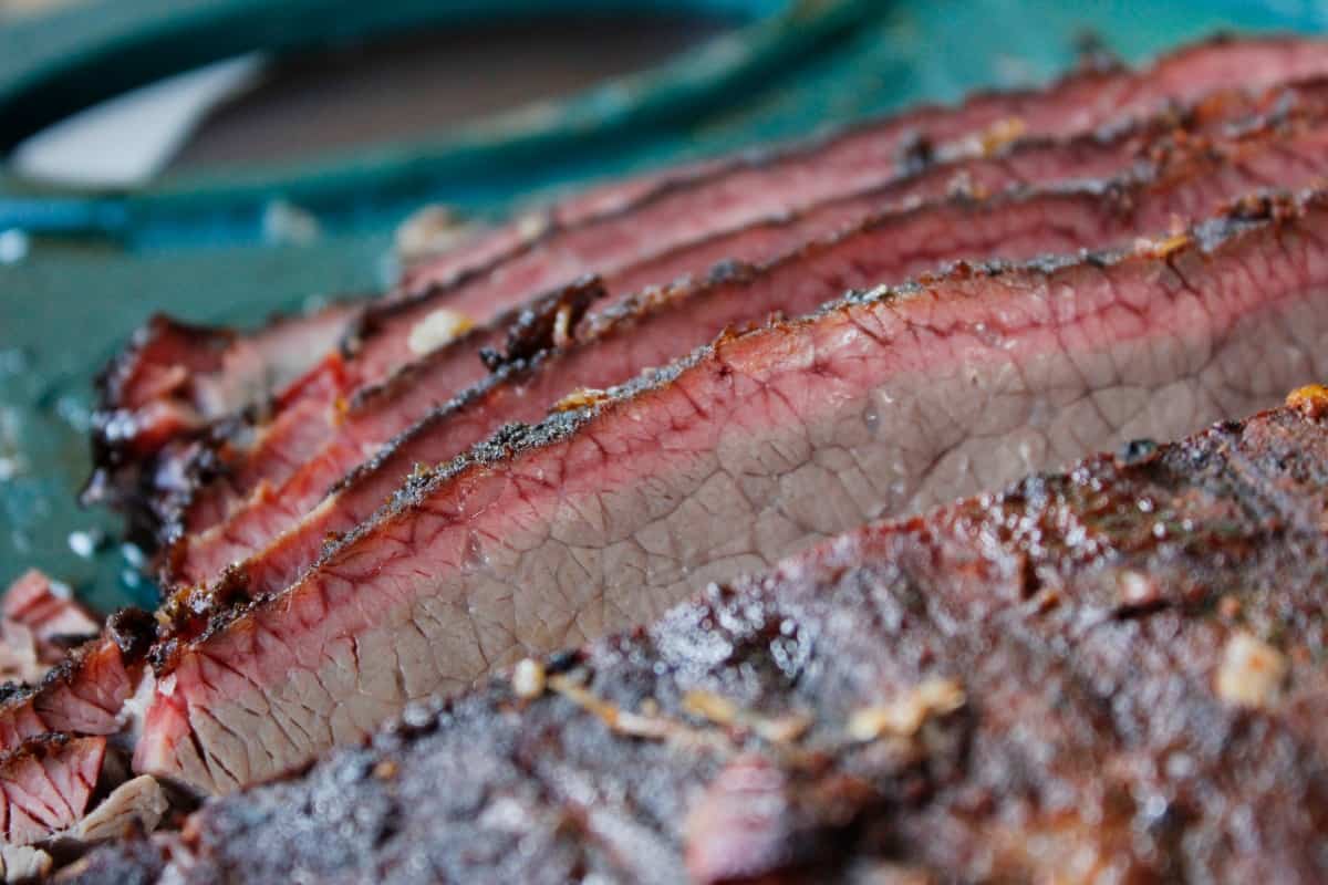 Brisket slices with a good, natural looking smoke r.