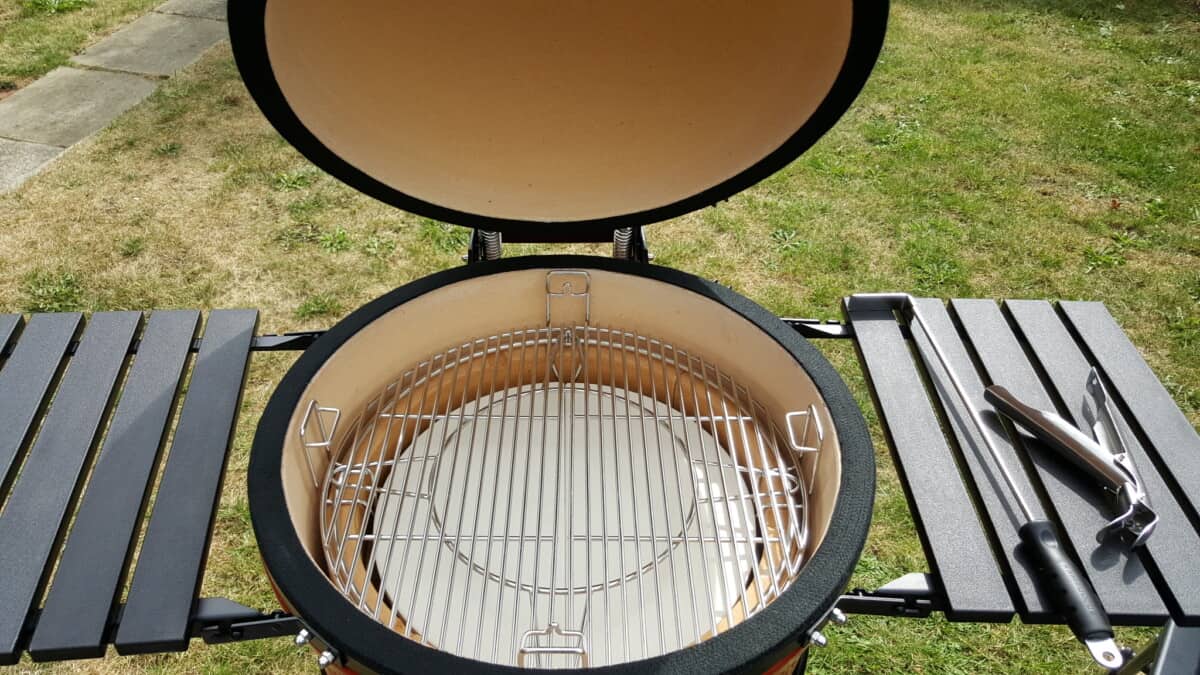 Kamado Joe classic V1 with lid open, showing divide and conquer grate system.