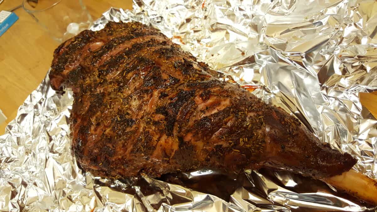 A smoke roasted lamb lag that has just been unwrapped from foil.