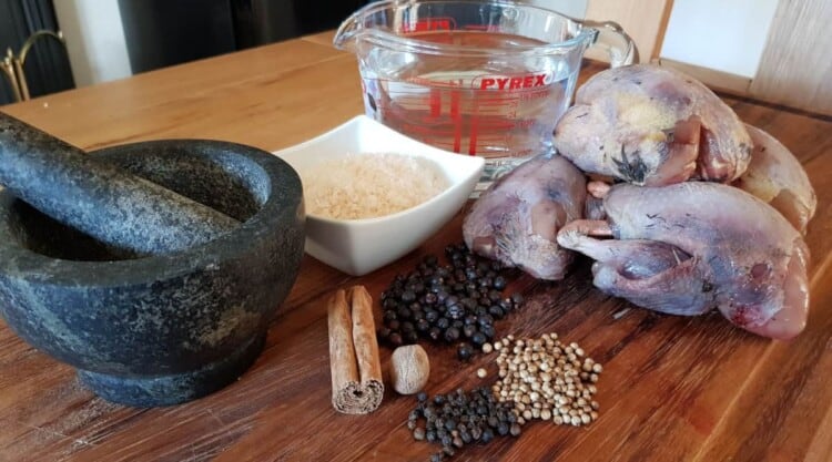 Ingredients prepared for dry brining some partridge, all seen laid out on a chopping board