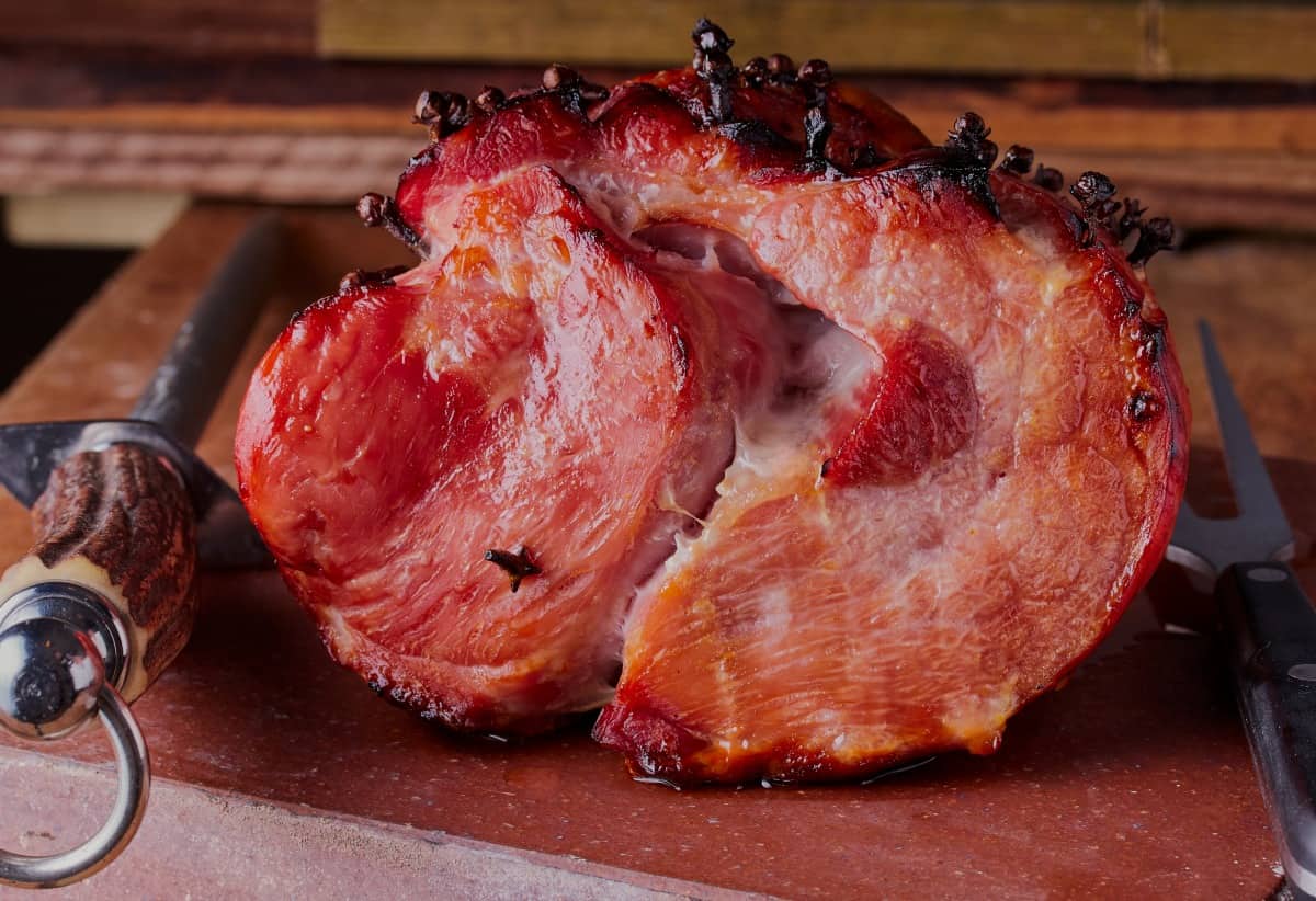 cooked meat cooling on a cutting bo.