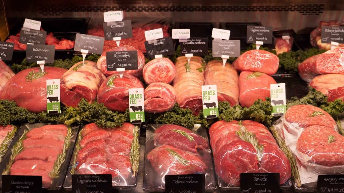 A selection of different meats at a butchers shop meat coun.