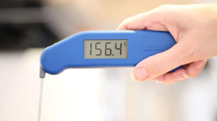 Instant read thermometer showing 156 F at the stall