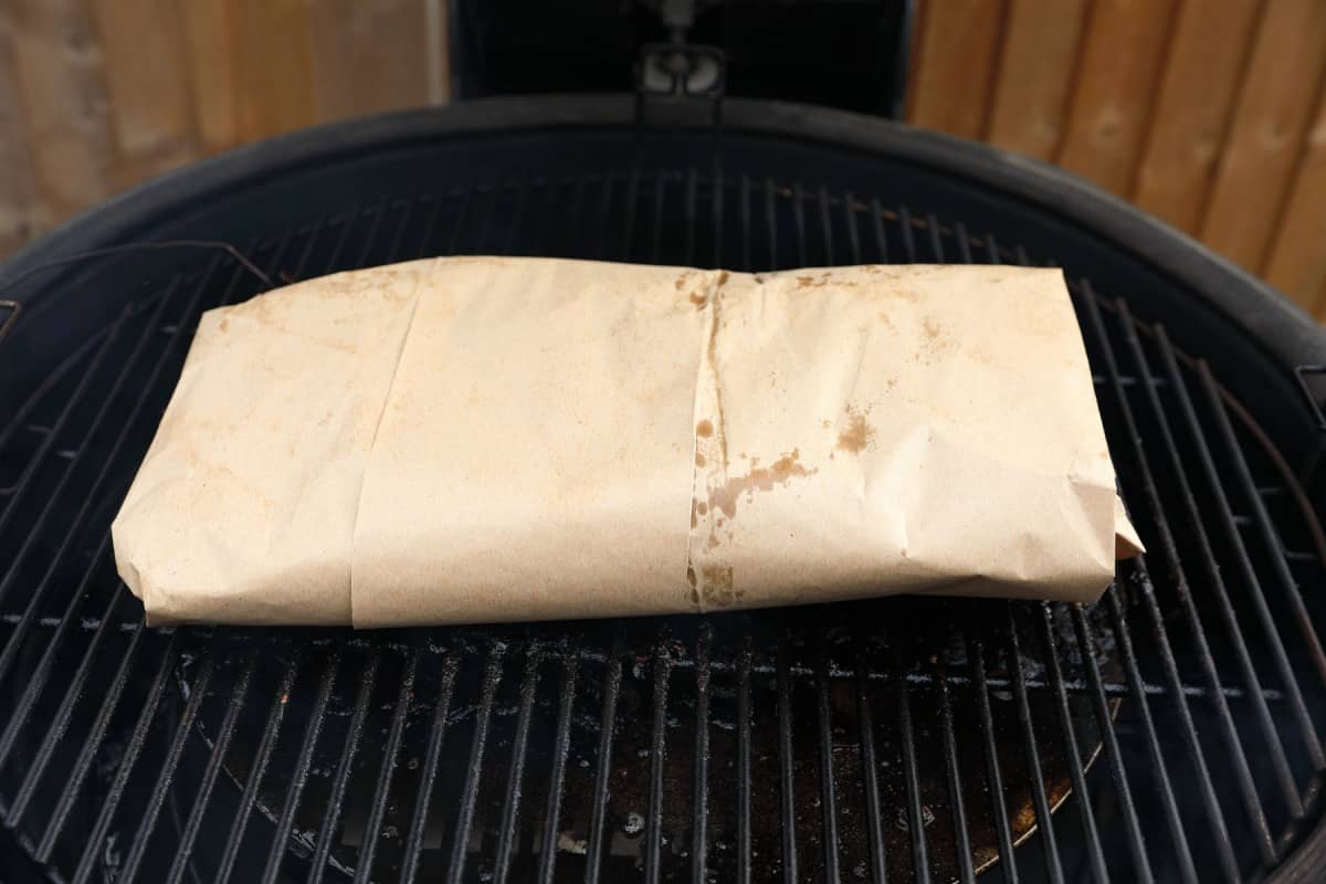 Brisket wrapped in butcher paper, still on the smo.