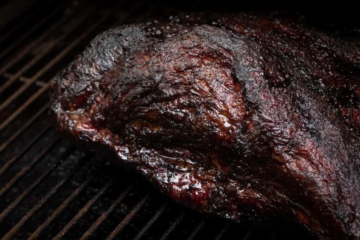 Close up of beef brisket BBQ bark, while still sitting in the smo.