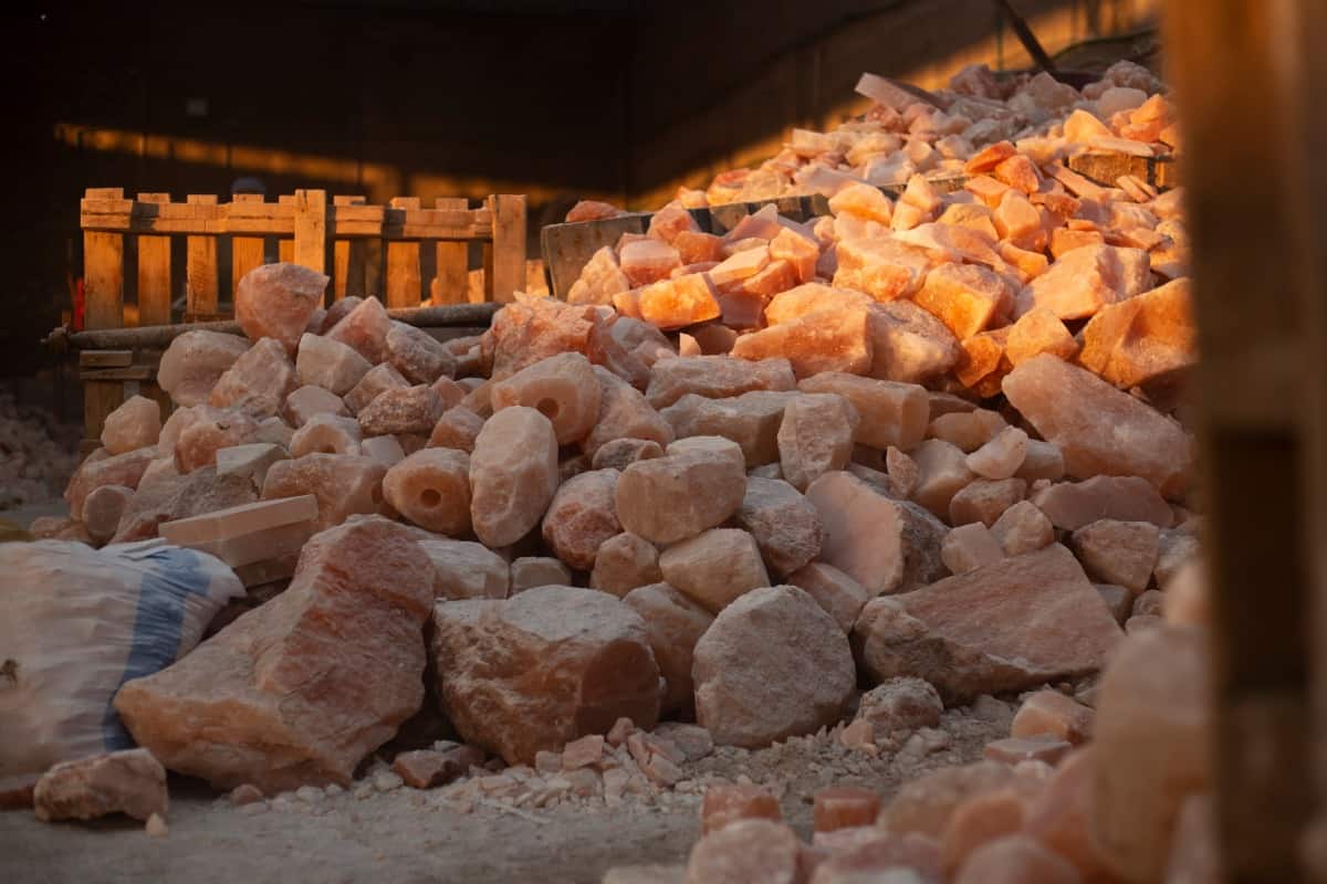 Salt rocks piled high in a Himalayan salt fact.