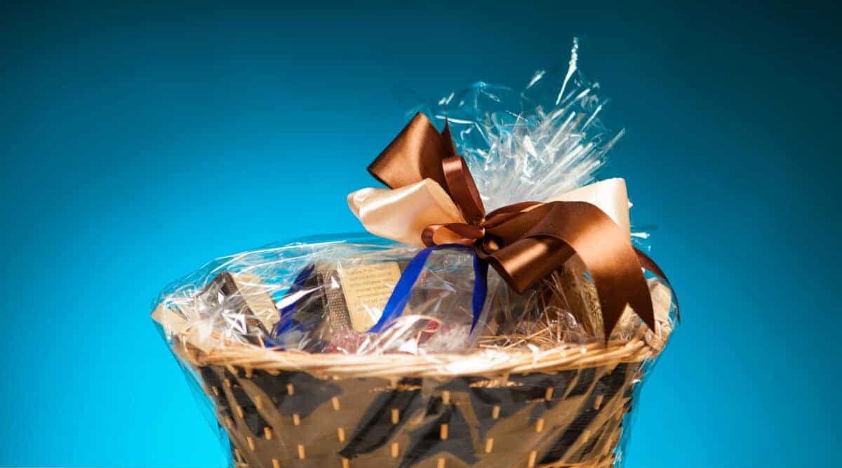 A gift basket isolated against a blue background.
