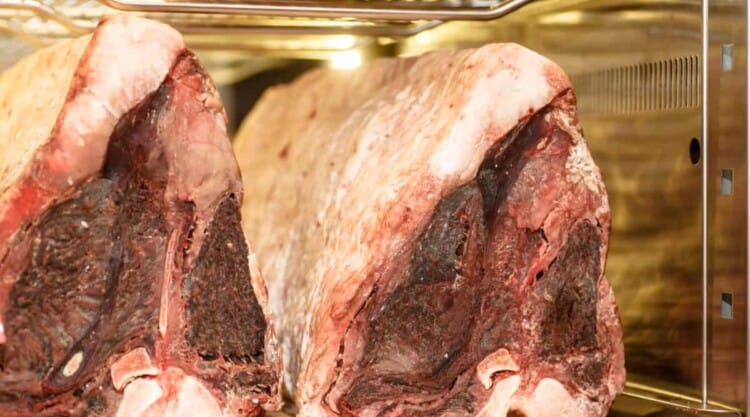 Dry aging beef in a refrigerator.