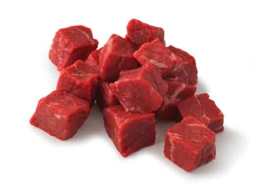 Beef stew meat isolated on wh.