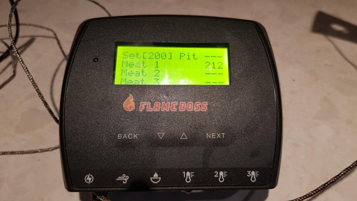 Flame boss 500 showing 212F with a probe in boiling wa.