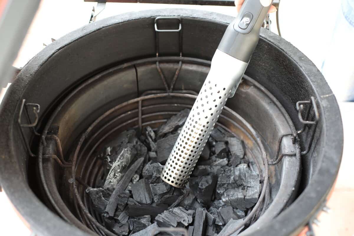 Looftlighter 1 electric firestarter being used to start a Kamado Joe grill.