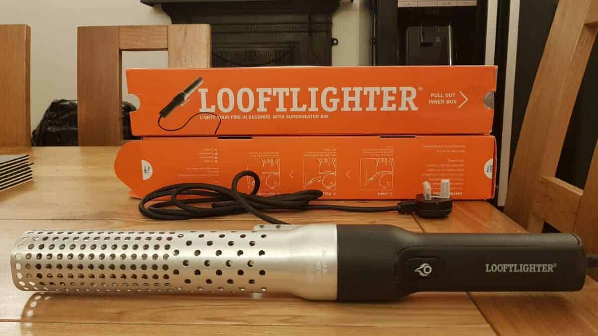 A Looftlighter in front of it's orange box packaging on a wooden table.