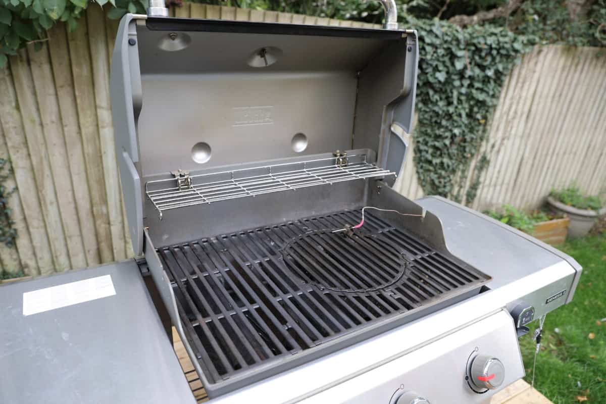 weber genesis II E-31o with lid open, a close up of the grates and inside the cooking chamber