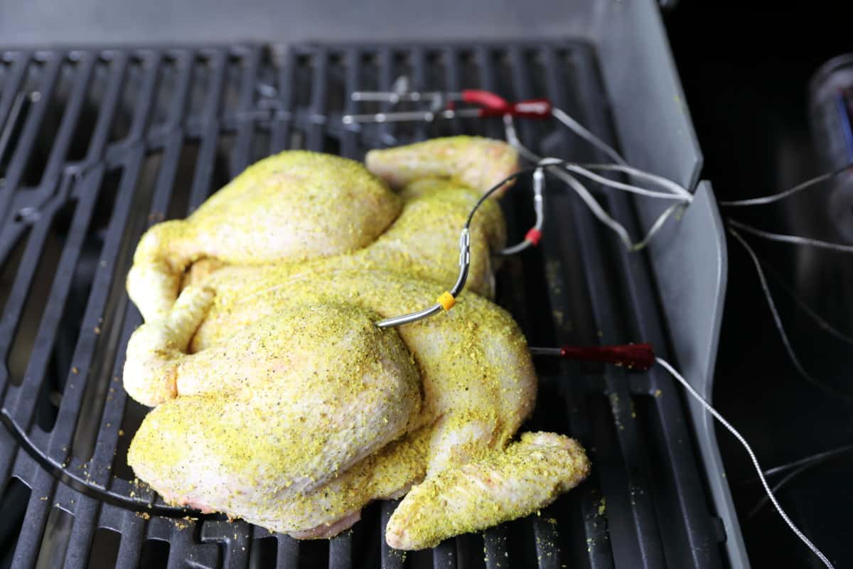 Spatchcock chicken on the grates of my weber genesis gas grill.