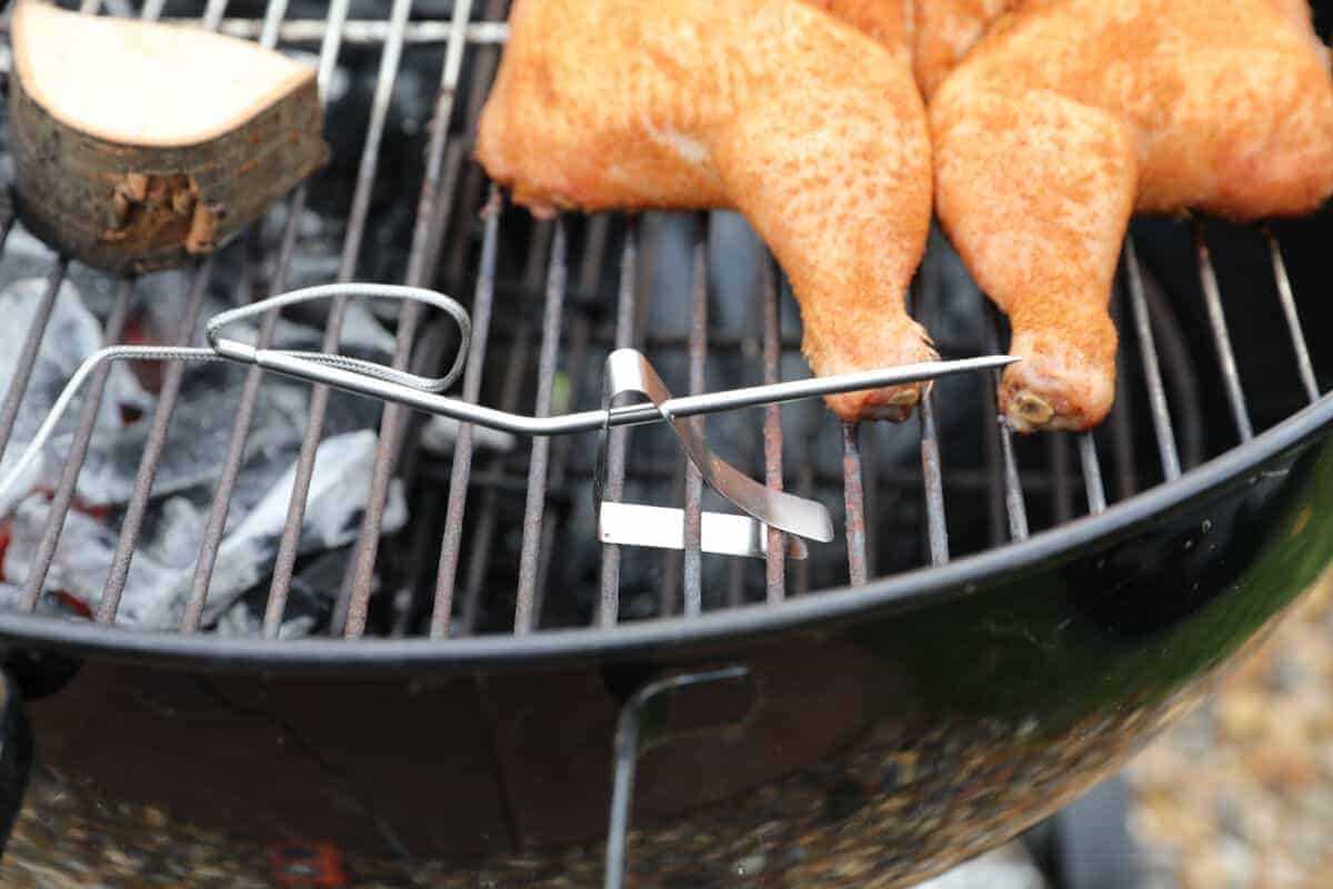 Thermopro tp20 pit probe on a Weber WSM, with wood and a spatchcock chicken
