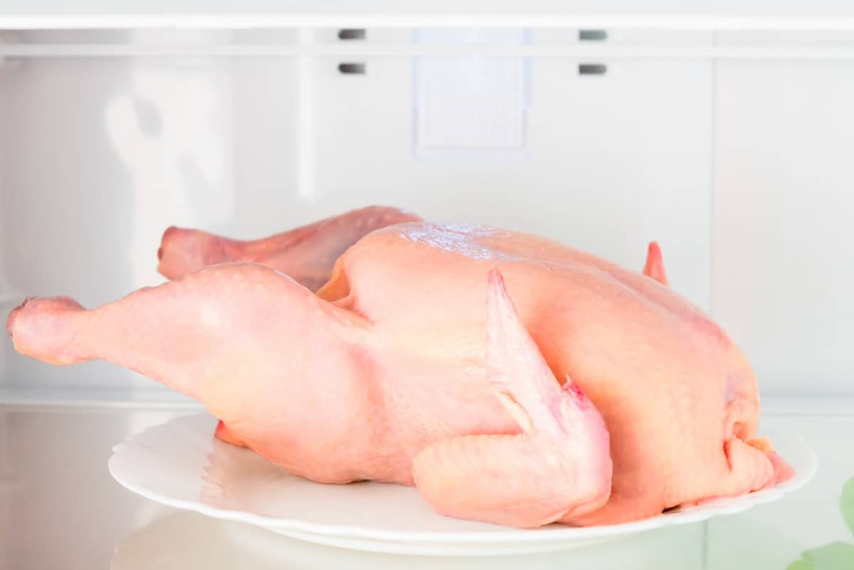  Defrosted whole chicken in refrigera.
