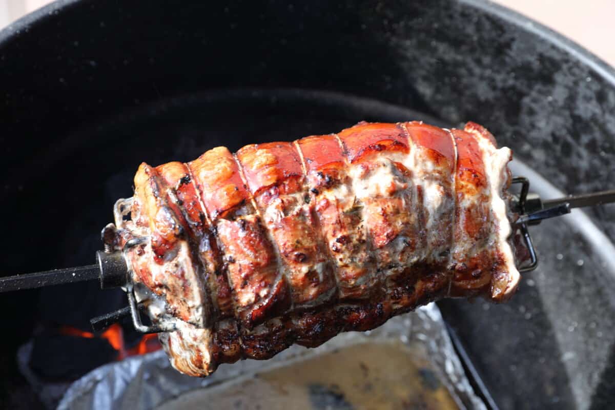 Porchetta on a rotisserie.