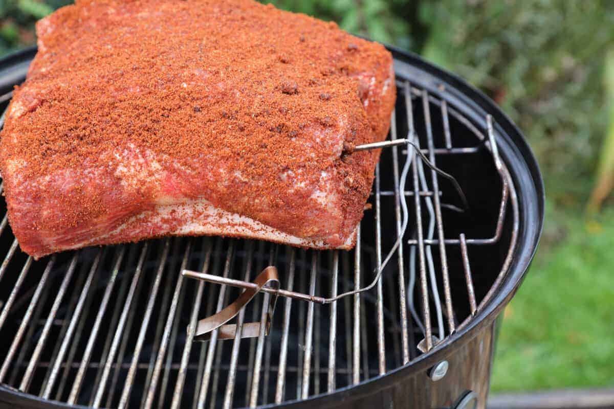 thermopro tp08 thermometer in use in a pork butt on a weber WSM in use