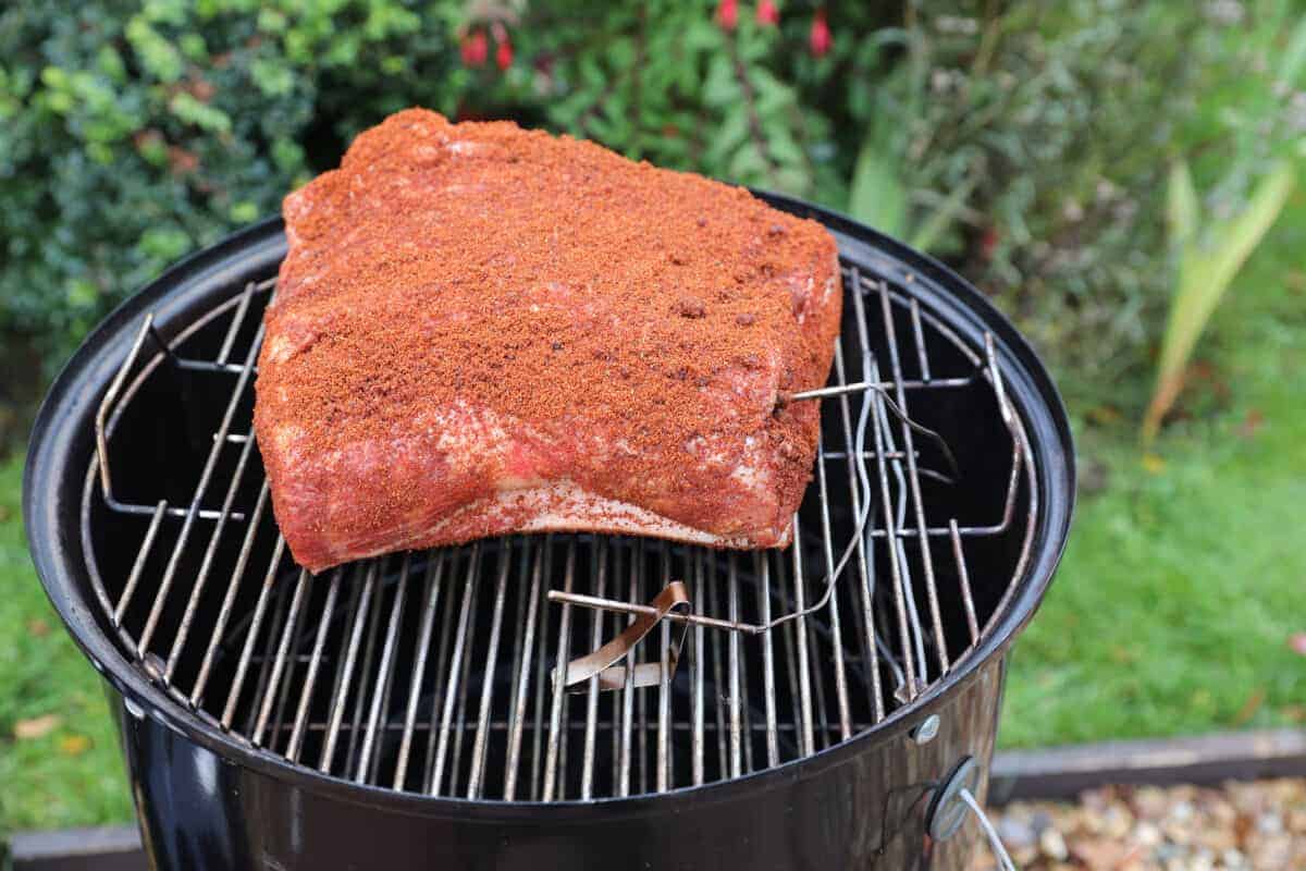 Pork butt being smoked on the Weber Smokey Mountain smo.