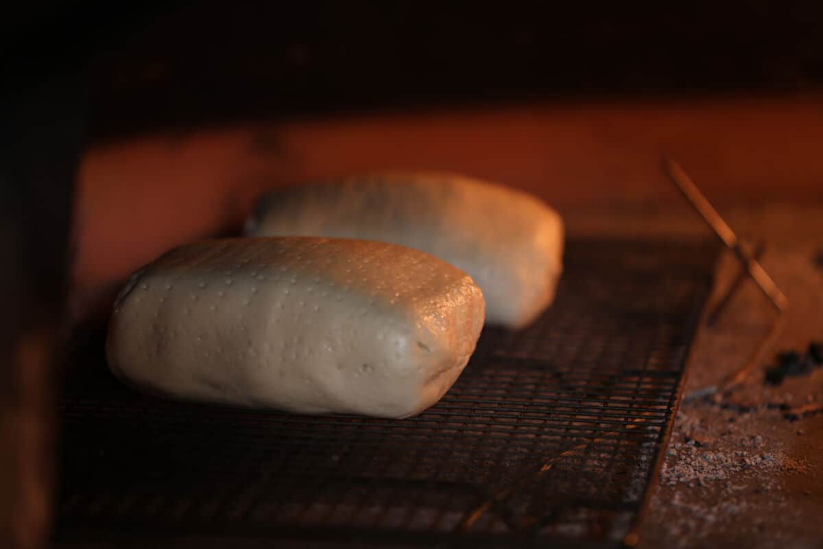 Two beef wellington placed in a wood fired o.