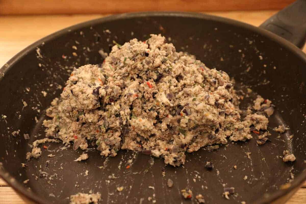 Finished porchetta stuffing mix in a frying pan