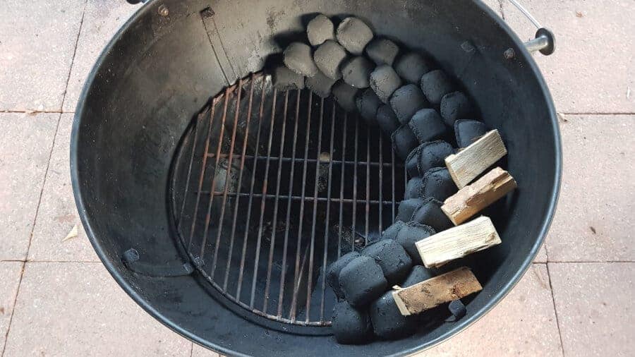 Close up of a charcoal snake setup for grill.