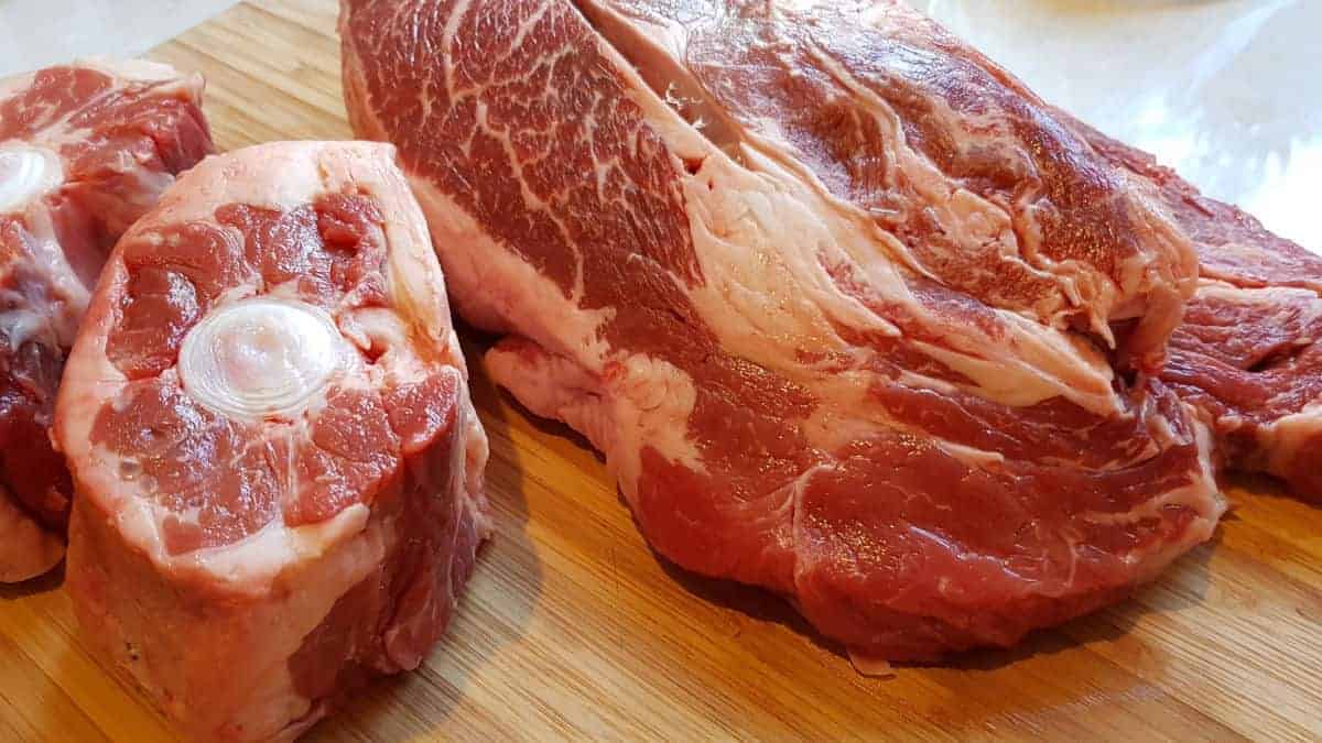 Close up of oxtail and chuck on a chopping bo.