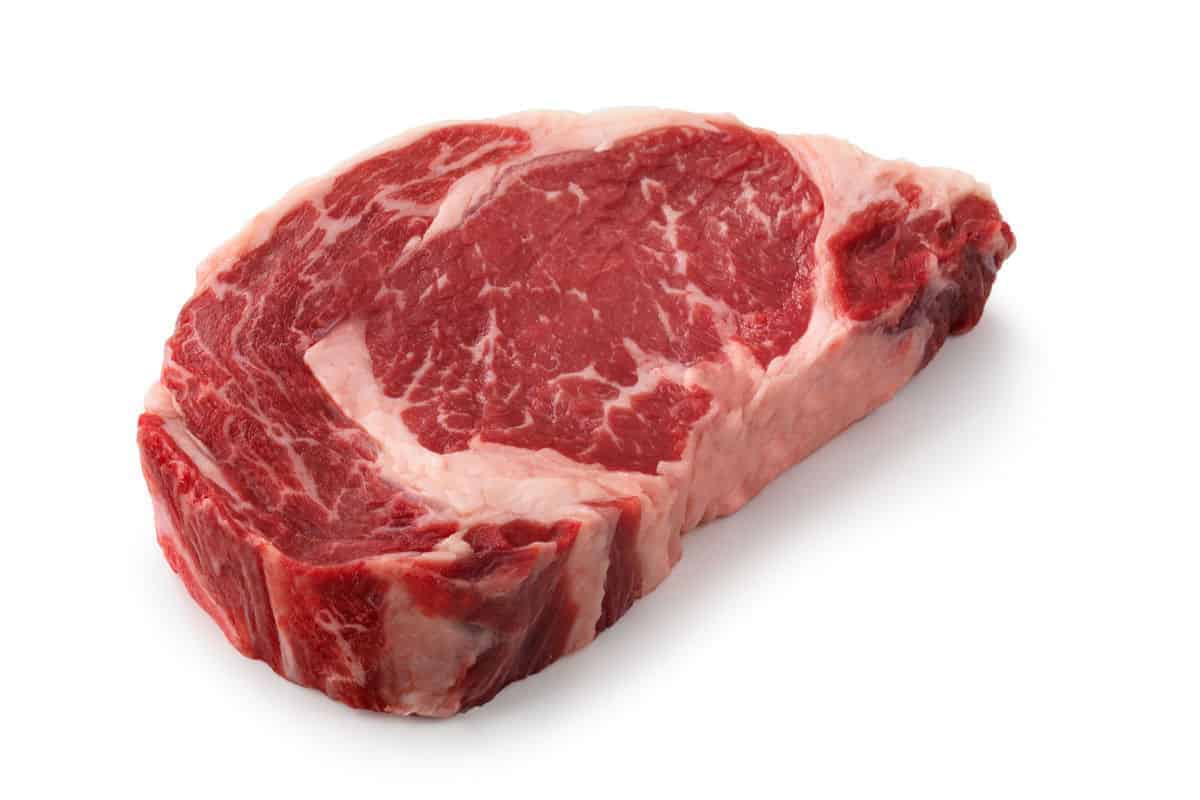 A ribeye steak isolated on white
