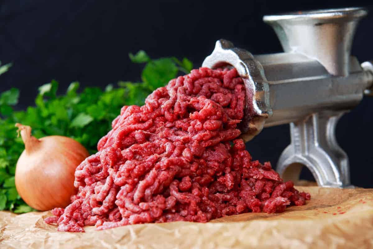 Beef being put through a mincer