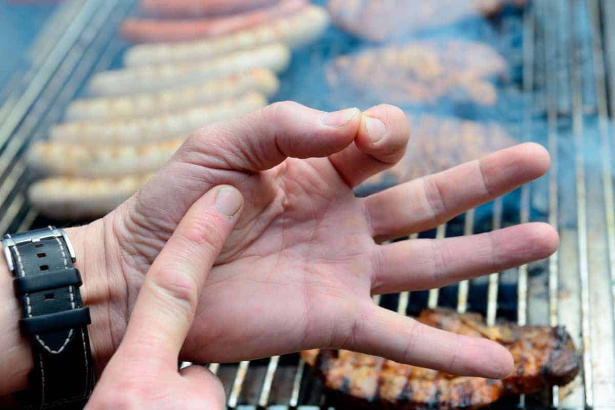 Using palm of hand to measure doneness of burger