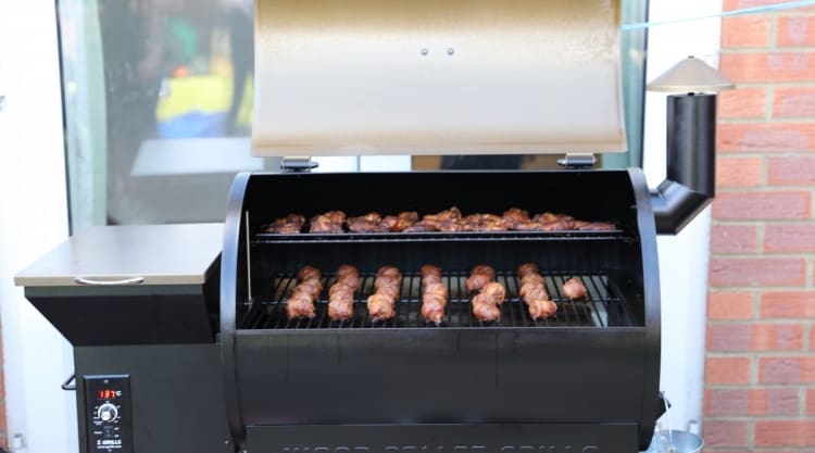 moinks and wings inside a Z grills 700D pellet smoker