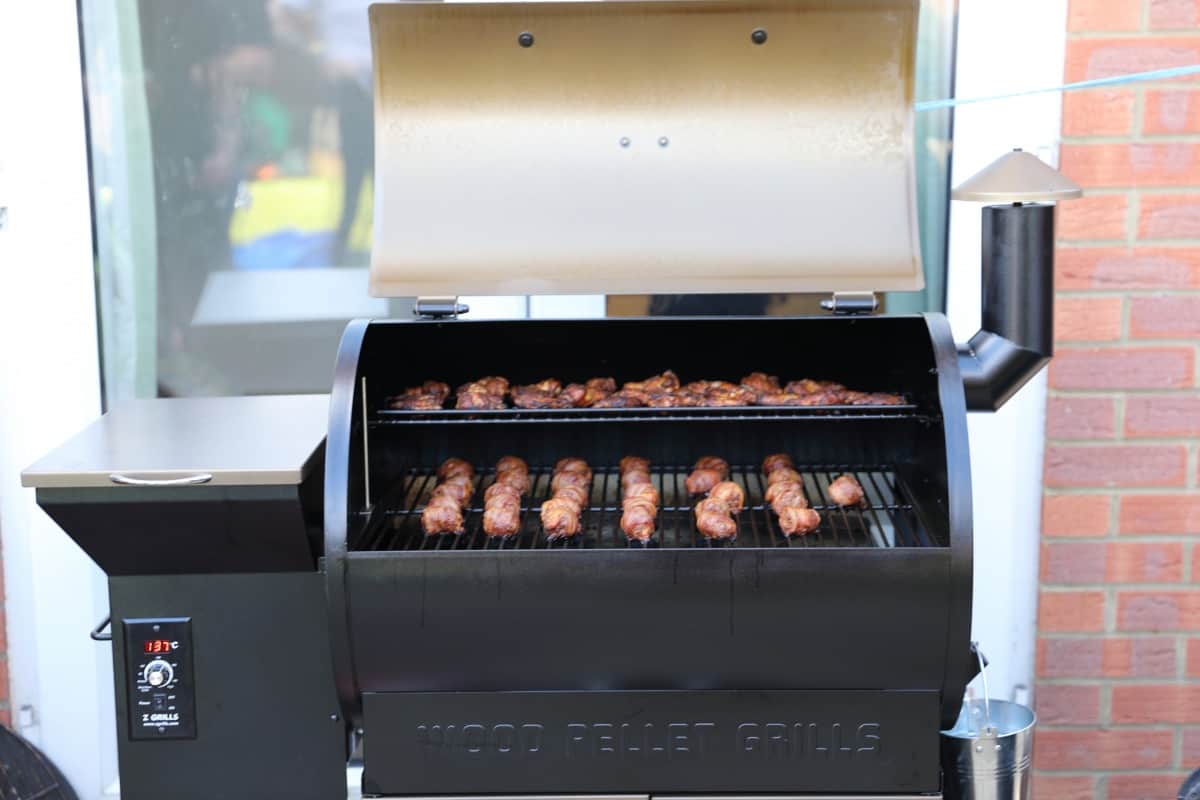 moinks and wings inside a Z grills 700D pellet smoker.
