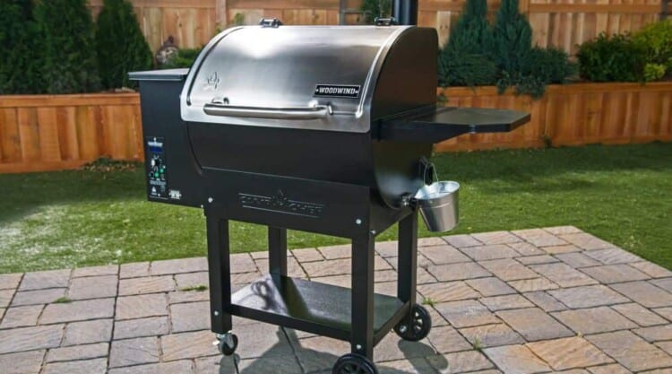 a camp chef woodwind classic pellet grill on a paved patio.